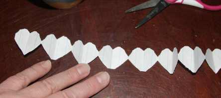 Paper chain of hearts for summer craft project.